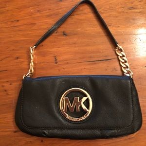 Michael Kors black dress purse with gold chain.
